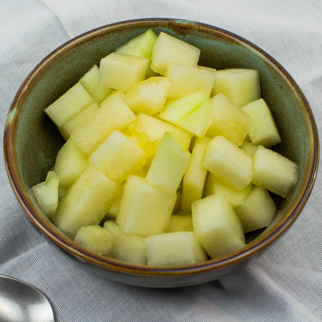 Dés de melon vert